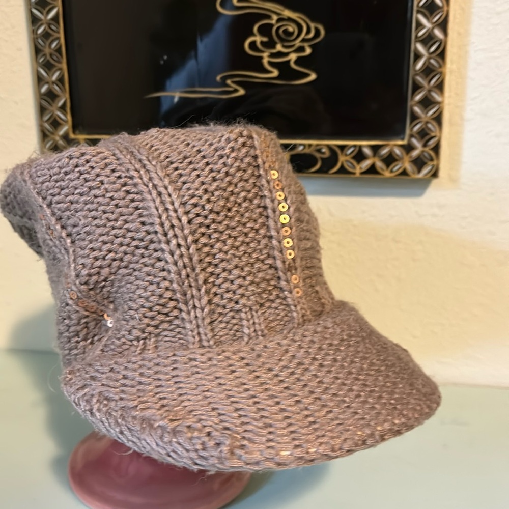 Fownes knit hat with visor and sequins.